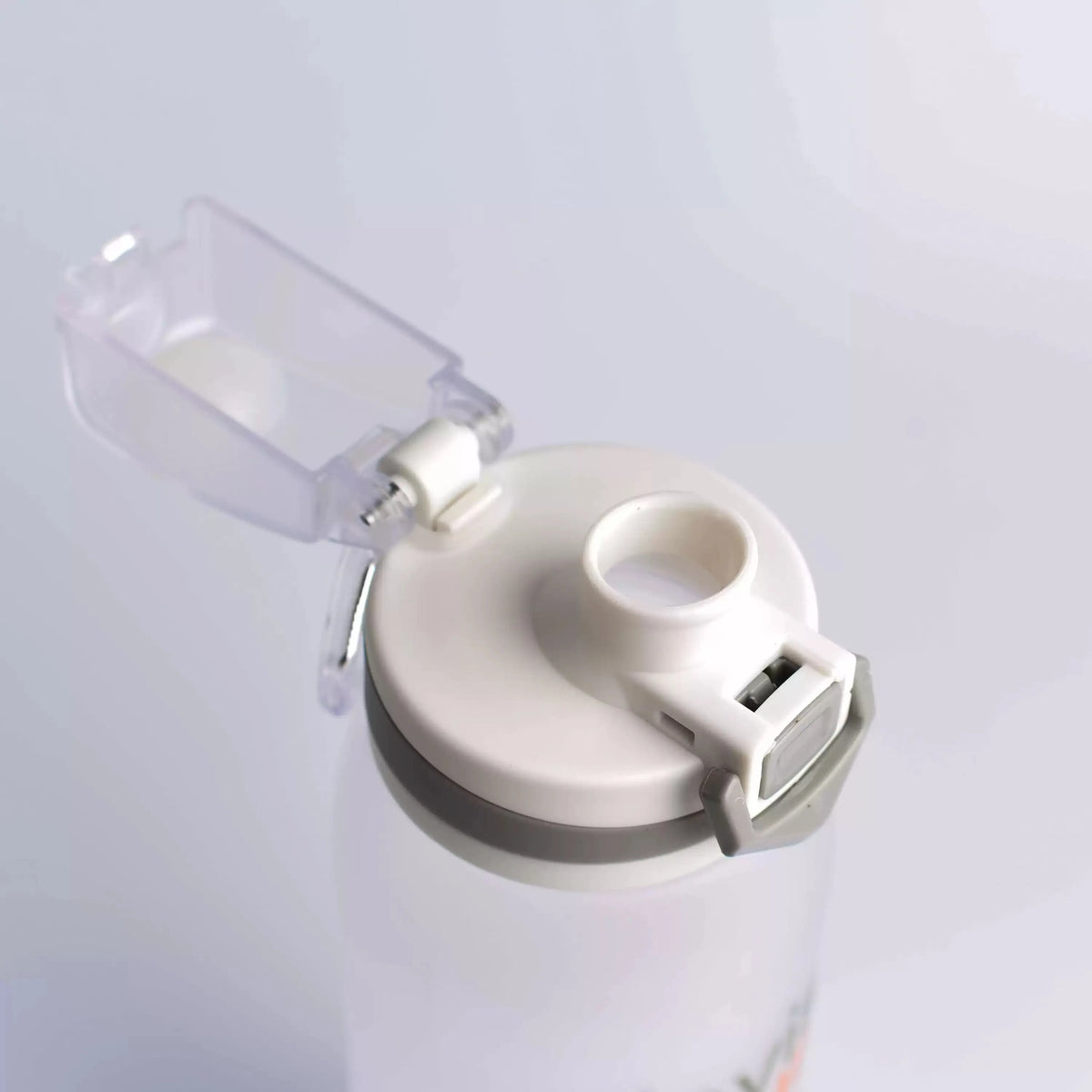 Close-up of the water bottle's open flip-top lid, showing the drinking spout and latch