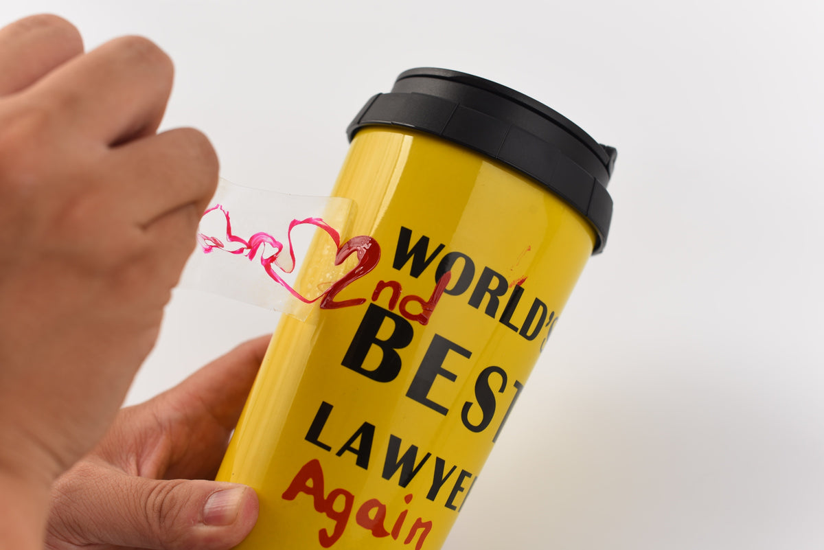 Close-up of the red lettering detail on the lawyer mug